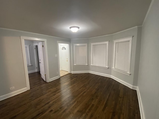 4224 N Kimball Ave, Chicago, IL 60618 - unfurnished room with dark wood finished floors, baseboards, and crown molding
