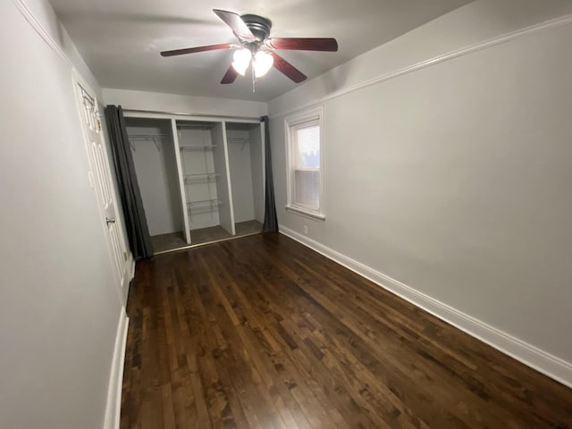 4224 N Kimball Ave, Chicago, IL 60618 - unfurnished bedroom featuring dark wood-style flooring, a closet, a ceiling fan, and baseboards