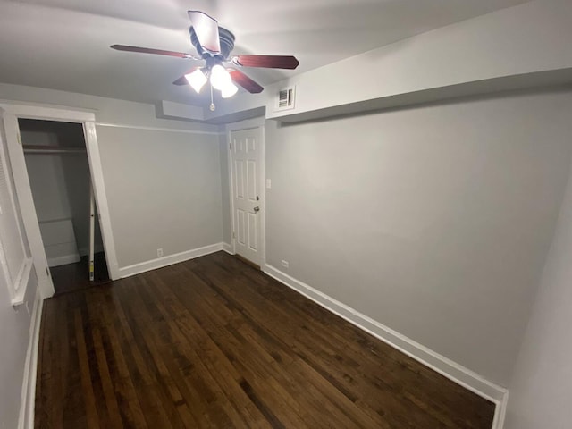 4224 N Kimball Ave, Chicago, IL 60618 - unfurnished bedroom featuring dark wood finished floors, baseboards, and a ceiling fan