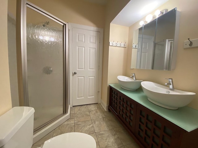 4224 N Kimball Ave, Chicago, IL 60618 - bathroom featuring toilet, a shower stall, and double vanity