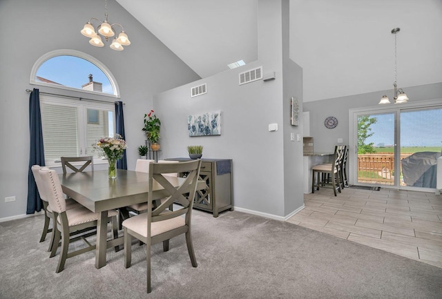 2825 Centurion Ln, New Lenox, IL 60451 - dining space with high vaulted ceiling, a chandelier, baseboards, and carpet floors