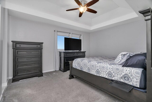 2825 Centurion Ln, New Lenox, IL 60451 - carpeted bedroom featuring a raised ceiling, baseboards, and ceiling fan