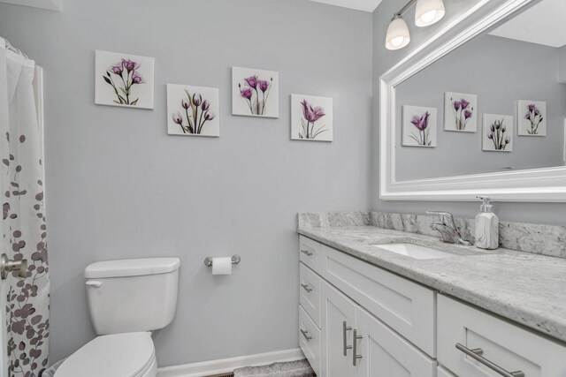 2825 Centurion Ln, New Lenox, IL 60451 - bathroom with vanity, toilet, baseboards, and a shower with shower curtain