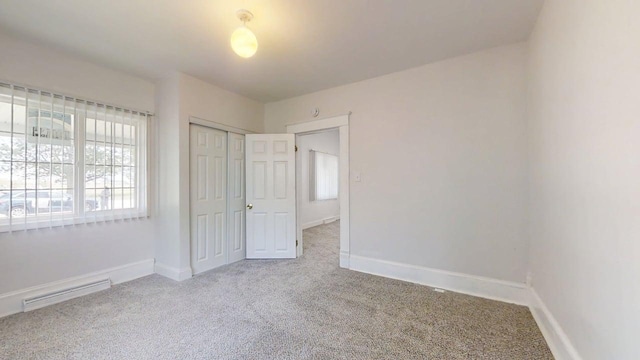418 S Main St, Rankin, IL 60960 - unfurnished bedroom featuring carpet flooring and a closet