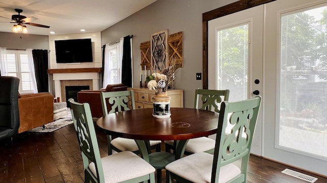 2703 Westbrook Dr, Bloomington, IL 61705 - dining space with wood-type flooring, a ceiling fan, and a fireplace