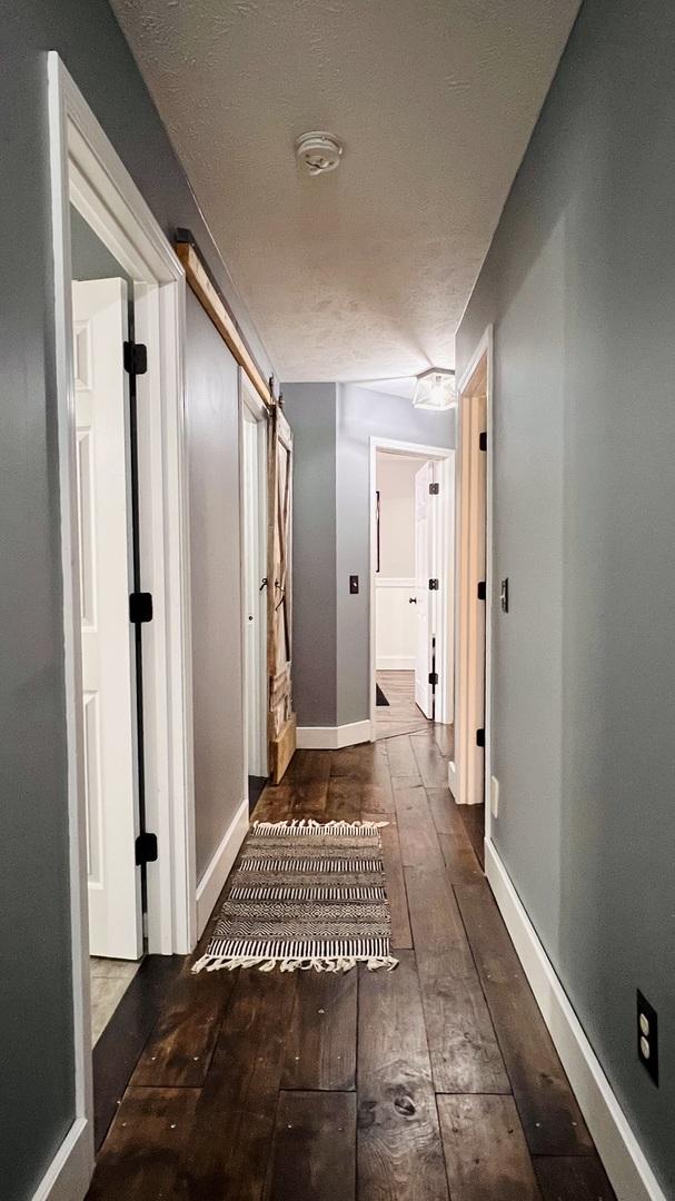 2703 Westbrook Dr, Bloomington, IL 61705 - corridor with hardwood / wood-style floors and baseboards