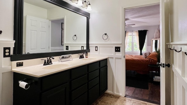 2703 Westbrook Dr, Bloomington, IL 61705 - full bathroom with connected bathroom, double vanity, and a ceiling fan