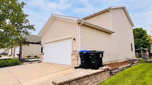 2703 Westbrook Dr, Bloomington, IL 61705 - view of property exterior with driveway and an attached garage