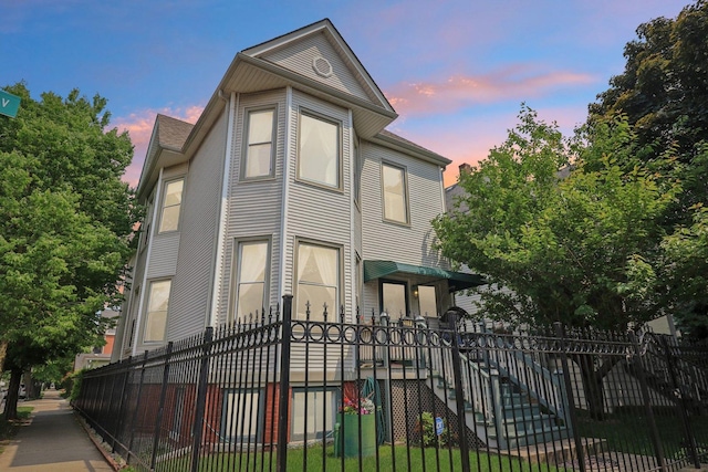 2559 N Saint Louis Ave, Chicago, IL 60647 - view of front of house with a fenced front yard and stairs