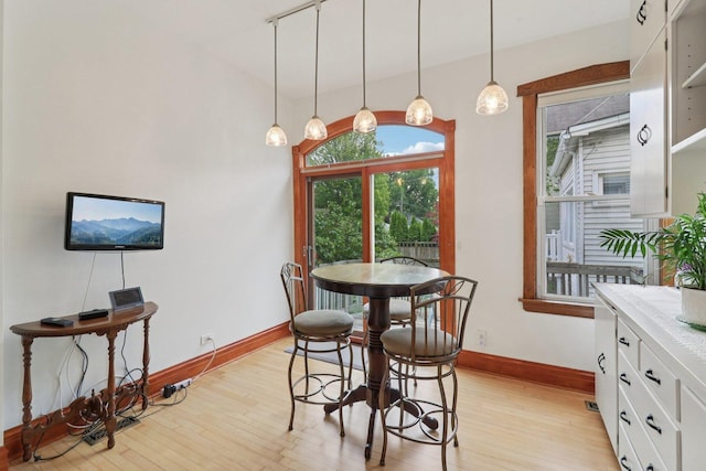 2559 N Saint Louis Ave, Chicago, IL 60647 - dining space with light wood finished floors and baseboards