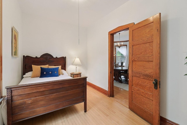 2559 N Saint Louis Ave, Chicago, IL 60647 - bedroom with light wood finished floors and baseboards