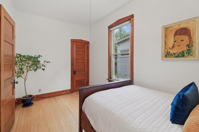 2559 N Saint Louis Ave, Chicago, IL 60647 - bedroom with light wood-style flooring and baseboards