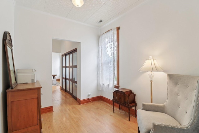 2559 N Saint Louis Ave, Chicago, IL 60647 - sitting room featuring ornamental molding and light wood-type flooring