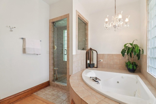 2559 N Saint Louis Ave, Chicago, IL 60647 - bathroom featuring a shower stall, a jetted tub, and a chandelier