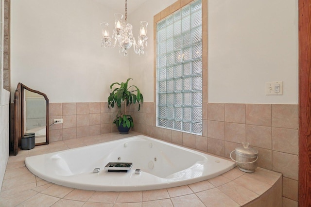 2559 N Saint Louis Ave, Chicago, IL 60647 - full bathroom with a whirlpool tub and a chandelier