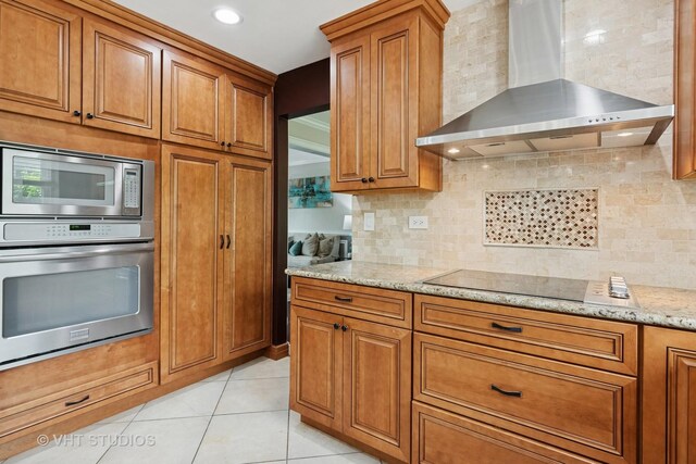 1981 White Oak Dr, Algonquin, IL 60102 - kitchen with wall chimney exhaust hood, appliances with stainless steel finishes, and brown cabinets