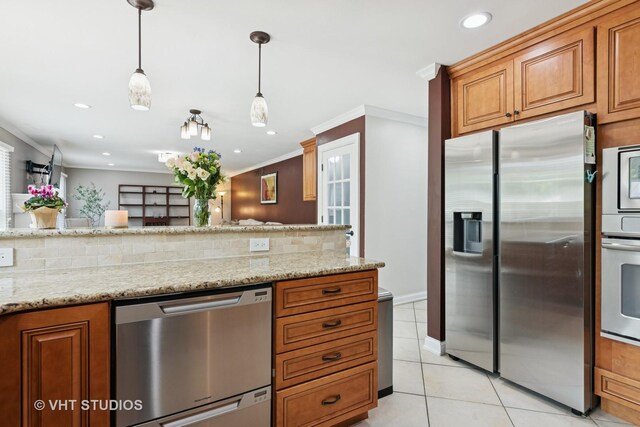 1981 White Oak Dr, Algonquin, IL 60102 - kitchen featuring appliances with stainless steel finishes, brown cabinets, light tile patterned floors, tasteful backsplash, and crown molding