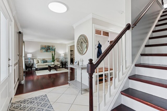1981 White Oak Dr, Algonquin, IL 60102 - foyer entrance featuring light tile patterned floors, crown molding, and stairway