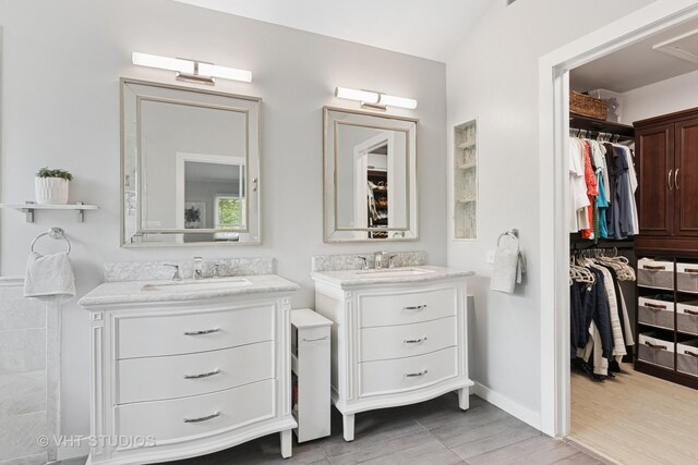 1981 White Oak Dr, Algonquin, IL 60102 - full bathroom with two vanities, a spacious closet, wood finished floors, and baseboards