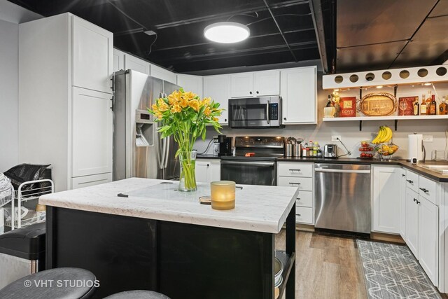 1981 White Oak Dr, Algonquin, IL 60102 - kitchen with stainless steel appliances, open shelves, wood finished floors, and white cabinets
