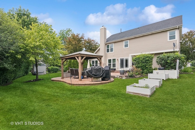 1981 White Oak Dr, Algonquin, IL 60102 - rear view of house featuring a gazebo, a patio area, a chimney, a lawn, and a garden
