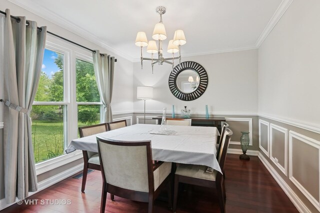 1981 White Oak Dr, Algonquin, IL 60102 - dining area with a chandelier, crown molding, dark wood-type flooring, wainscoting, and a decorative wall