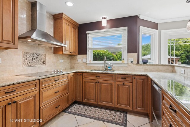 1981 White Oak Dr, Algonquin, IL 60102 - kitchen featuring wall chimney range hood, a sink, black electric cooktop, brown cabinets, and light stone counters