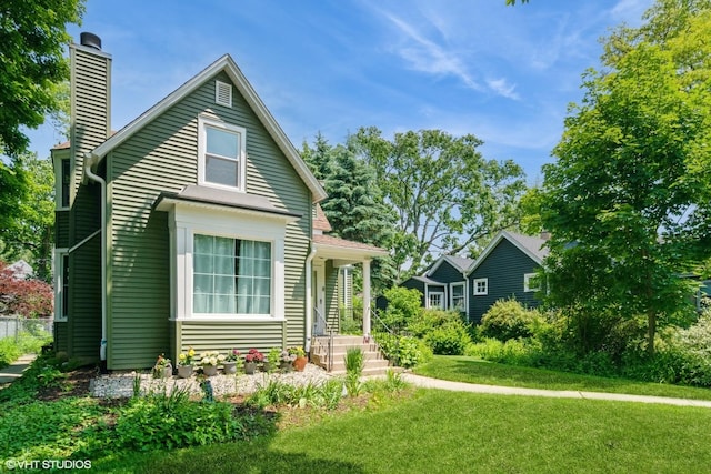 2617 Thayer St, Evanston, IL 60201 - view of front of property featuring a chimney and a front lawn