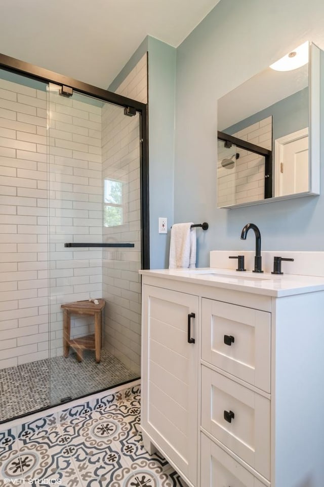 2617 Thayer St, Evanston, IL 60201 - full bath with vanity, a stall shower, and tile patterned flooring
