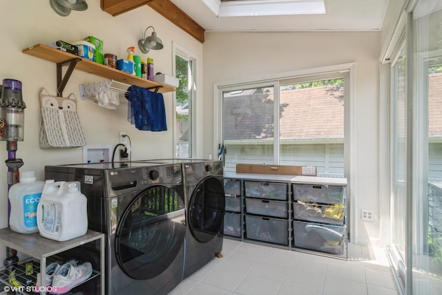 2617 Thayer St, Evanston, IL 60201 - washroom featuring independent washer and dryer, tile patterned flooring, and plenty of natural light