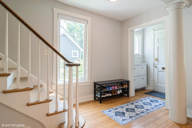 2617 Thayer St, Evanston, IL 60201 - entrance foyer with stairway, wood finished floors, and ornate columns