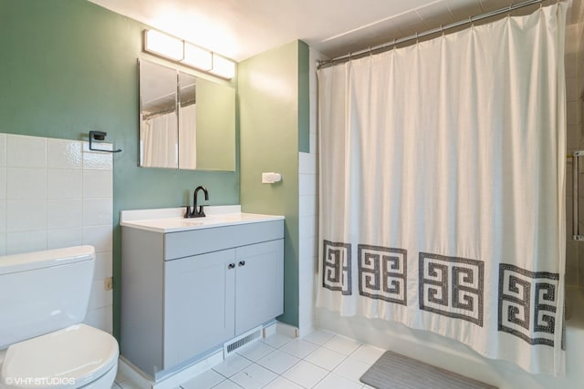 2617 Thayer St, Evanston, IL 60201 - full bathroom featuring vanity, shower / tub combo with curtain, and tile patterned flooring