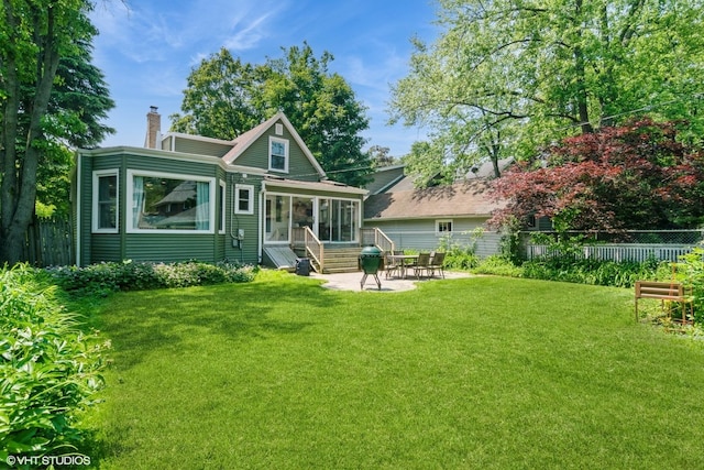 2617 Thayer St, Evanston, IL 60201 - back of property featuring entry steps, a chimney, and a patio area