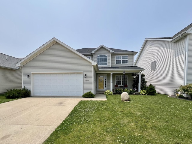 1313 W Ridge Ln, Champaign, IL 61822 - traditional home with a garage, driveway, a porch, and a front lawn