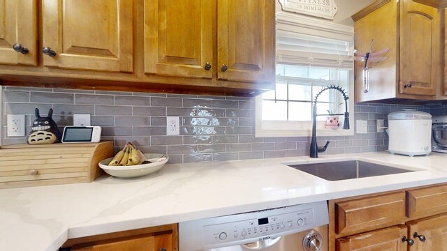 1313 W Ridge Ln, Champaign, IL 61822 - kitchen featuring dishwasher, decorative backsplash, brown cabinetry, and light stone countertops