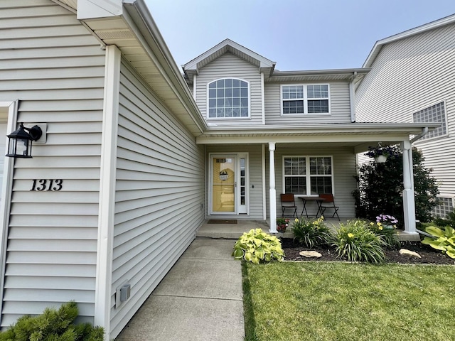 1313 W Ridge Ln, Champaign, IL 61822 - property entrance with a porch and a yard