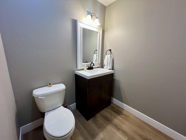 1313 W Ridge Ln, Champaign, IL 61822 - half bathroom with vanity and wood finished floors