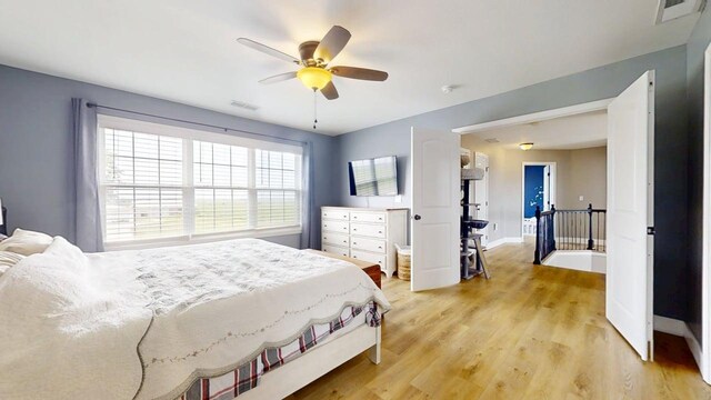 1313 W Ridge Ln, Champaign, IL 61822 - bedroom featuring light wood-style flooring and a ceiling fan