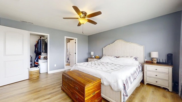 1313 W Ridge Ln, Champaign, IL 61822 - bedroom with light wood-type flooring, a closet, a ceiling fan, and ensuite bath