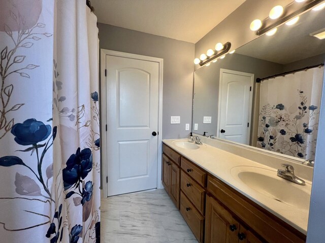 1313 W Ridge Ln, Champaign, IL 61822 - bathroom featuring marble look tile flooring and double vanity
