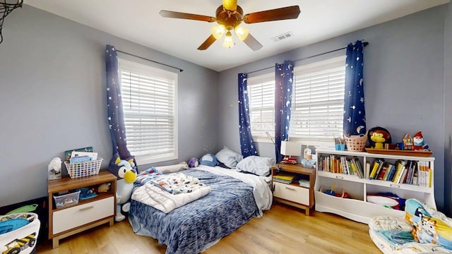 1313 W Ridge Ln, Champaign, IL 61822 - bedroom with wood finished floors and ceiling fan