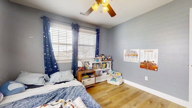1313 W Ridge Ln, Champaign, IL 61822 - bedroom featuring wood finished floors and a ceiling fan