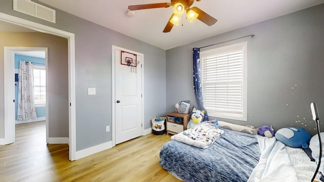 1313 W Ridge Ln, Champaign, IL 61822 - bedroom with light wood-style flooring and ceiling fan