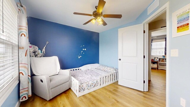 1313 W Ridge Ln, Champaign, IL 61822 - bedroom with wood finished floors and ceiling fan