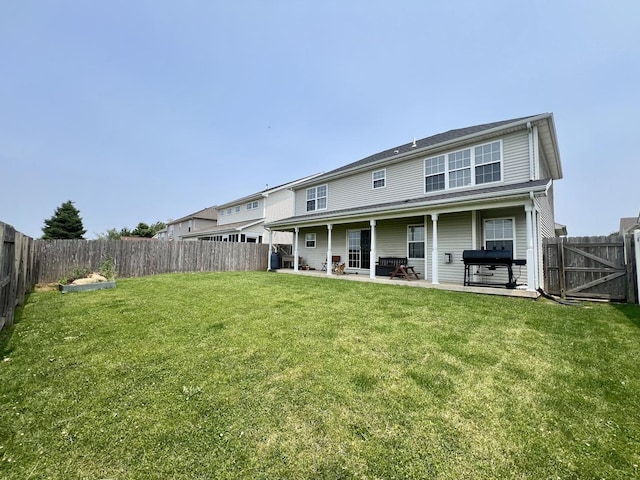 1313 W Ridge Ln, Champaign, IL 61822 - rear view of house featuring a fenced backyard and a patio area
