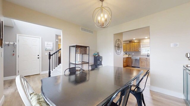 1313 W Ridge Ln, Champaign, IL 61822 - dining area featuring a chandelier, light wood-style flooring, and stairs