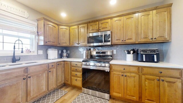 1313 W Ridge Ln, Champaign, IL 61822 - kitchen featuring appliances with stainless steel finishes, light countertops, decorative backsplash, and recessed lighting