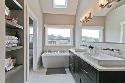 26205 W Forrester Dr, Plainfield, IL 60585 - bathroom featuring a chandelier, double vanity, a freestanding bath, and toilet