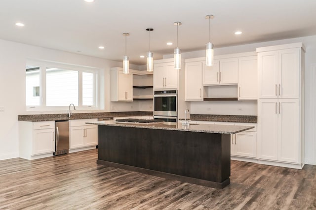 26205 W Forrester Dr, Plainfield, IL 60585 - kitchen with open shelves, stainless steel appliances, a kitchen island with sink, white cabinetry, and dark wood finished floors
