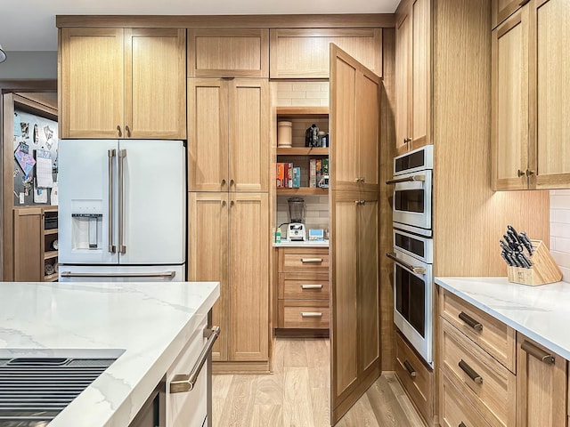 26205 W Forrester Dr, Plainfield, IL 60585 - kitchen featuring high end refrigerator, light stone countertops, light wood-style floors, and open shelves
